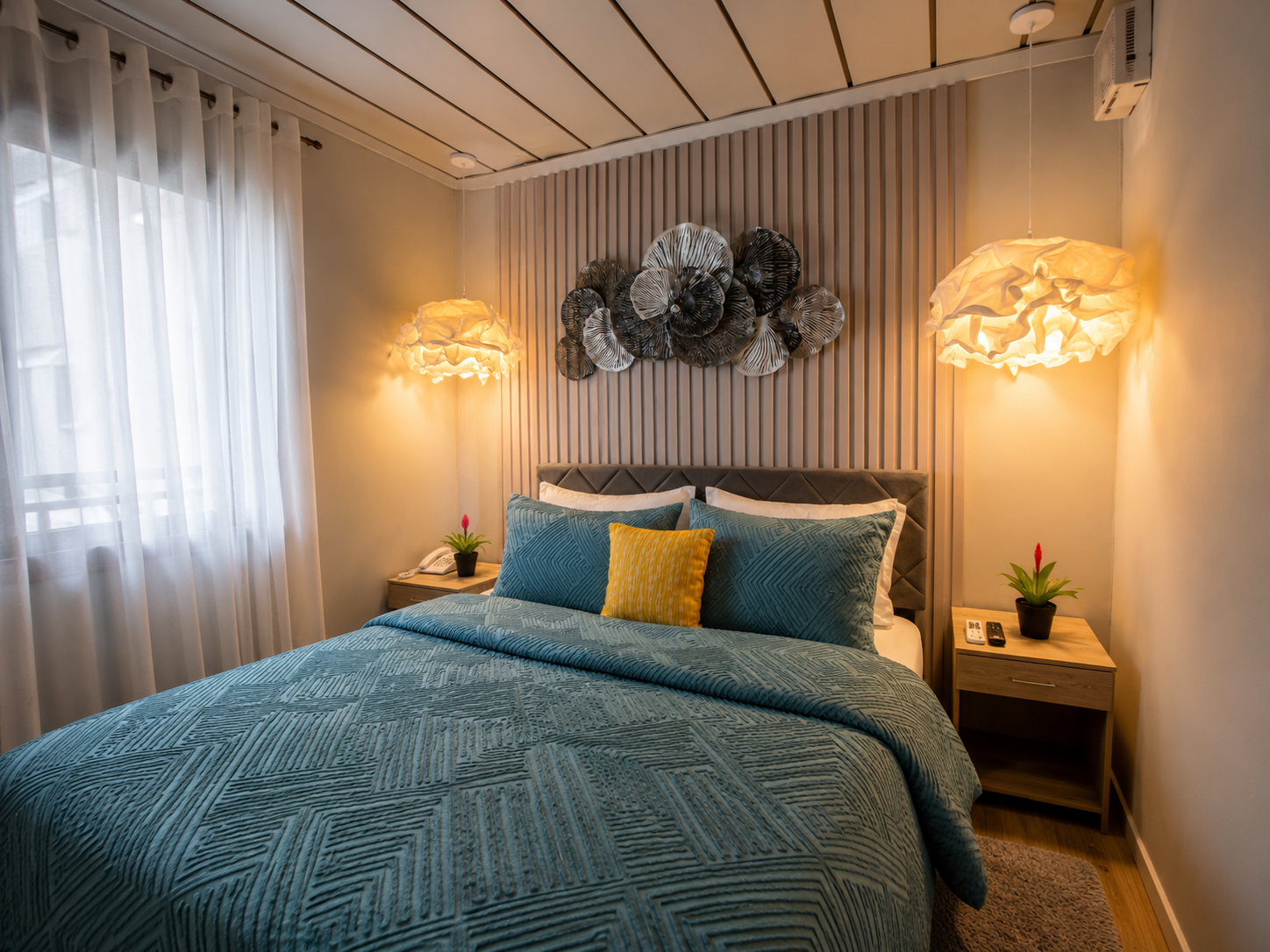 Living space with rattan furniture and an open-air ocean view.